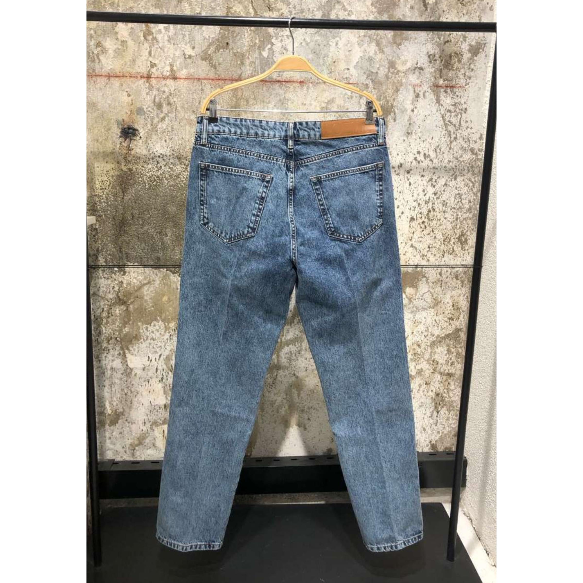 Light Blue Jeans with Embroidered Logos on Knees