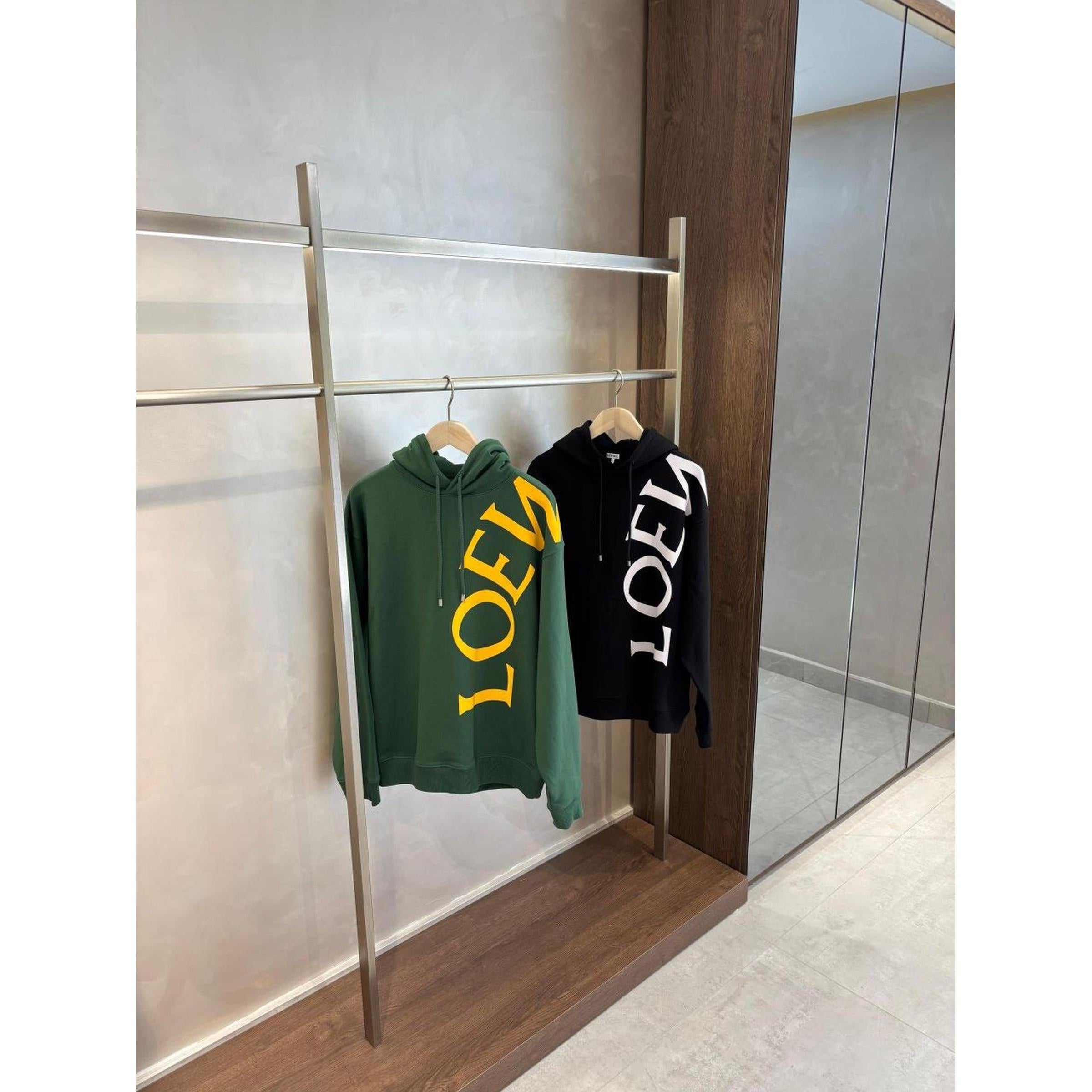 Crno-zelena prevelika majica s kapuljačom