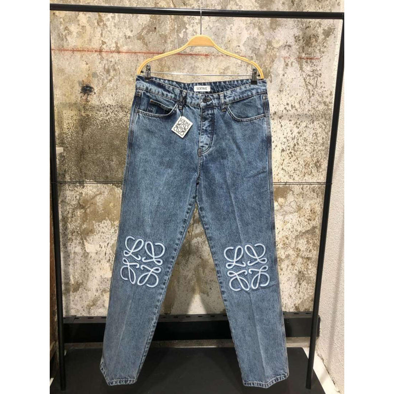 Light Blue Jeans with Embroidered Logos on Knees