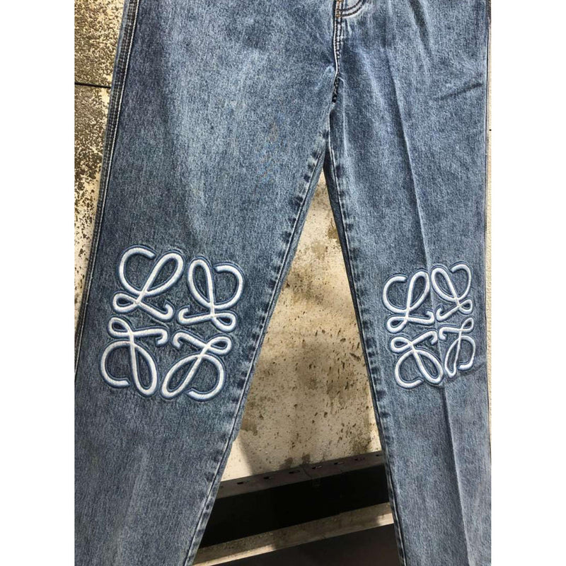 Light Blue Jeans with Embroidered Logos on Knees