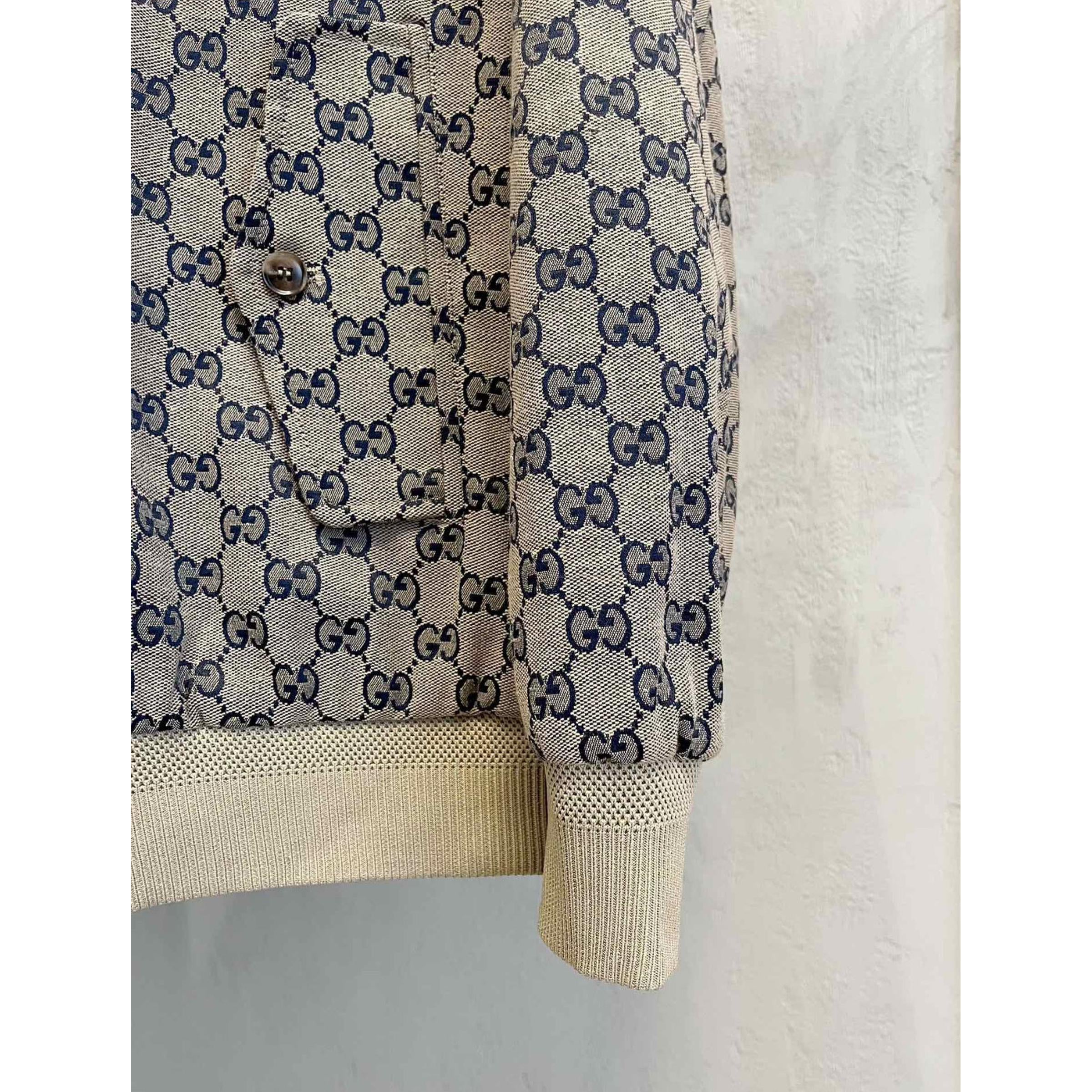 Béžová monogramová bomber bunda